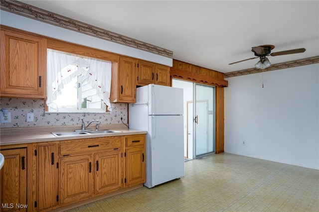 4855 Lake Dawn Dr, Medina, OH 44256 - kitchen with freestanding refrigerator, a sink, ceiling fan, and light countertops
