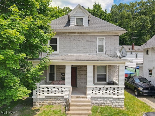 369 Cuyahoga St, Akron, OH 44310 - american foursquare style home featuring covered porch, stone siding, and a shingled roof
