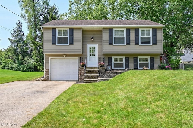 2610 Norton Rd, Stow, OH 44224 - raised ranch with a front yard, an attached garage, concrete driveway, and stone siding