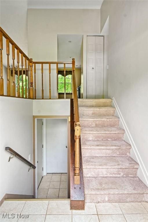 2610 Norton Rd, Stow, OH 44224 - staircase with tile patterned flooring and baseboards