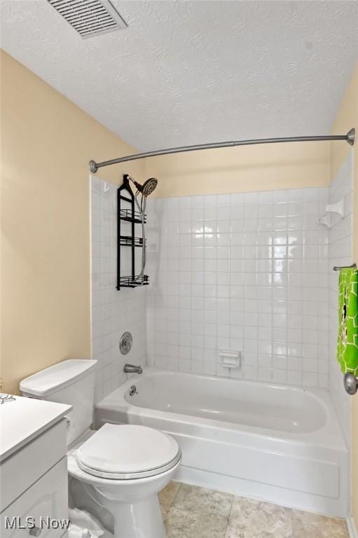 2610 Norton Rd, Stow, OH 44224 - bathroom with shower / tub combination, tile patterned floors, toilet, a textured ceiling, and vanity