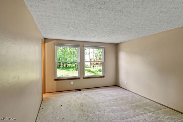 2610 Norton Rd, Stow, OH 44224 - carpeted empty room with a textured ceiling and baseboards