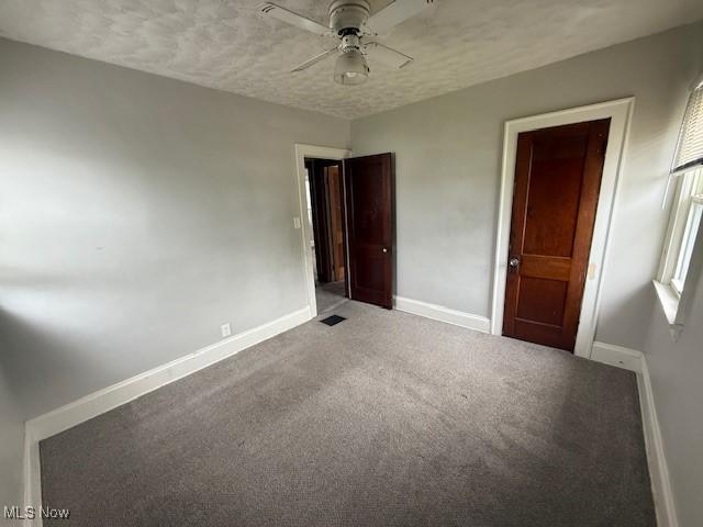 13603 Alvin Ave, Garfield Heights, OH 44105 - unfurnished bedroom featuring baseboards, carpet, ceiling fan, and a textured ceiling