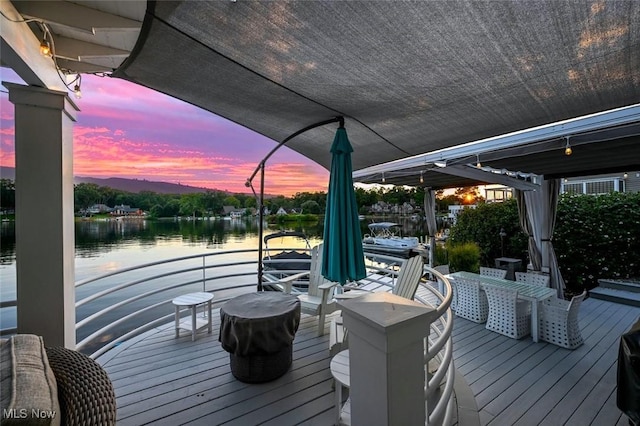 552 Saunders Ave, Akron, OH 44319 - deck at dusk featuring a water view