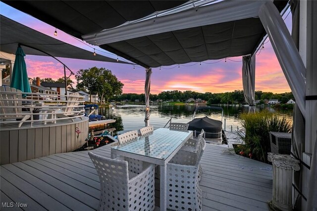 552 Saunders Ave, Akron, OH 44319 - deck at dusk with a water view and a boat dock