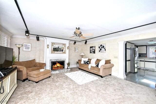 552 Saunders Ave, Akron, OH 44319 - living area with ceiling fan, crown molding, and a premium fireplace