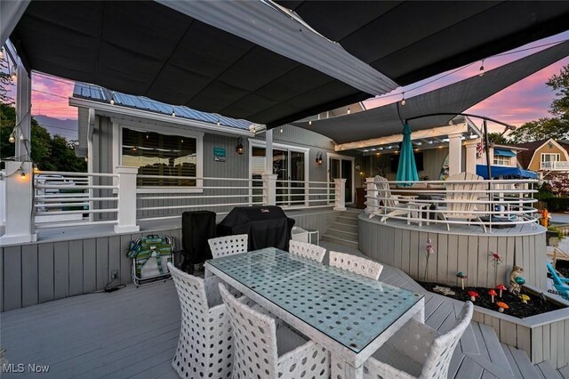 552 Saunders Ave, Akron, OH 44319 - wooden terrace featuring area for grilling and outdoor dining area