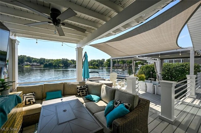552 Saunders Ave, Akron, OH 44319 - wooden deck with an outdoor hangout area, a ceiling fan, and a water view
