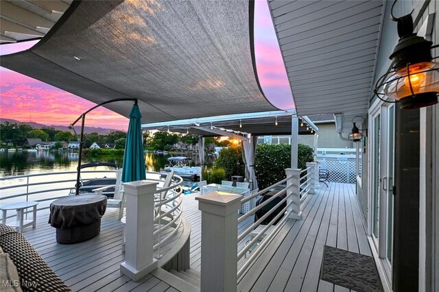 552 Saunders Ave, Akron, OH 44319 - deck at dusk with a water view and a dock
