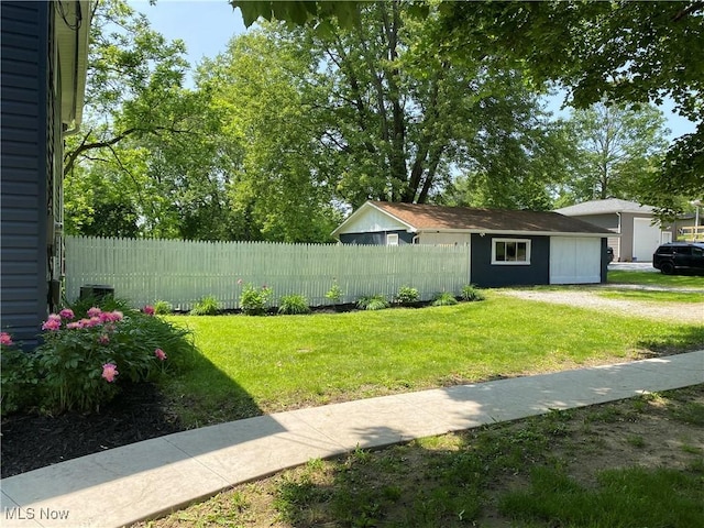 10919 Geib Ave NE, Hartville, OH 44632 - view of yard featuring a garage