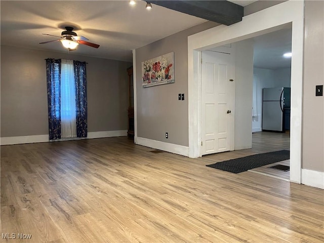 10919 Geib Ave NE, Hartville, OH 44632 - empty room with a ceiling fan, wood finished floors, and baseboards