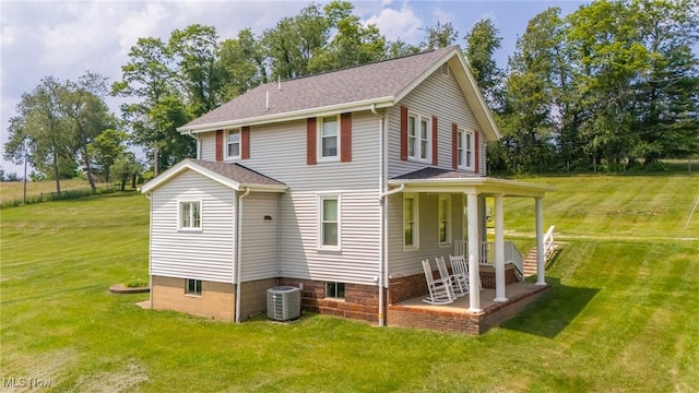 51300 Wegee Rd, Bellaire, OH 43906 - rear view of house featuring central air condition unit and a lawn