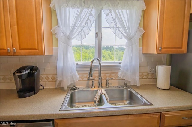 51300 Wegee Rd, Bellaire, OH 43906 - kitchen with a sink, light countertops, backsplash, dishwasher, and brown cabinets