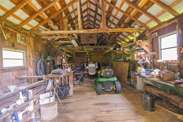 51300 Wegee Rd, Bellaire, OH 43906 - miscellaneous room featuring vaulted ceiling, plenty of natural light, wooden walls, and hardwood / wood-style floors