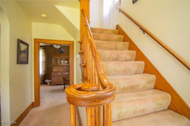 51300 Wegee Rd, Bellaire, OH 43906 - stairs with arched walkways, carpet floors, and baseboards