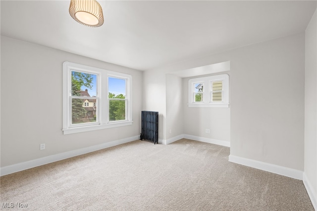 3497 Raymont Blvd, University Heights, OH 44118 - unfurnished living room featuring light colored carpet and baseboards