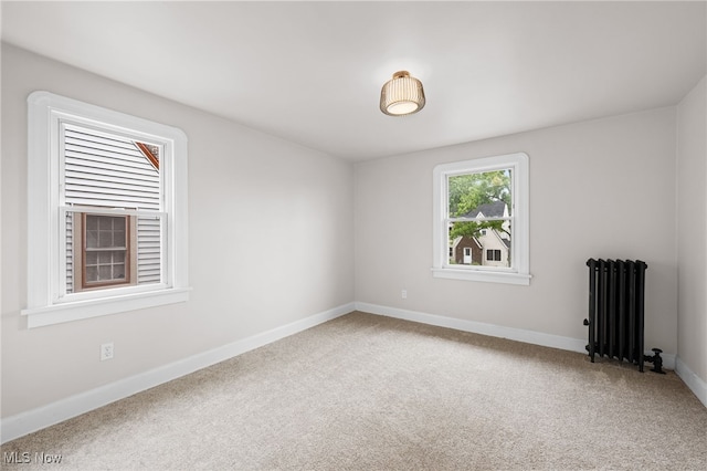 3497 Raymont Blvd, University Heights, OH 44118 - carpeted spare room featuring radiator heating unit and baseboards