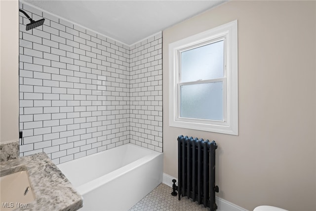 3497 Raymont Blvd, University Heights, OH 44118 - full bath featuring radiator, tile patterned floors, tub / shower combination, toilet, and vanity