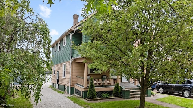 14520 Bayes Ave, Lakewood, OH 44107 - view of side of property with a chimney
