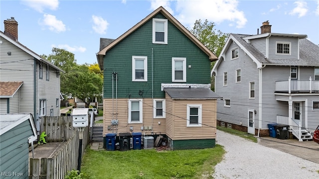 14520 Bayes Ave, Lakewood, OH 44107 - back of house with cooling unit and a chimney