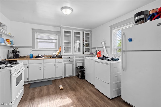 14520 Bayes Ave, Lakewood, OH 44107 - kitchen with white appliances, washing machine and dryer, white cabinetry, dark wood-style flooring, and glass insert cabinets