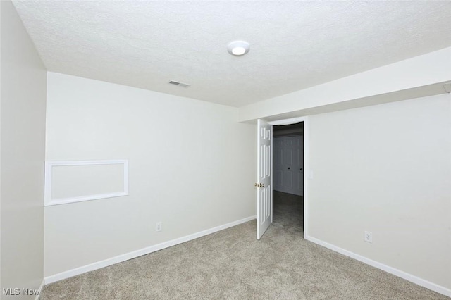 452 Herbert Rd, Akron, OH 44312 - unfurnished bedroom featuring light carpet, a textured ceiling, and baseboards