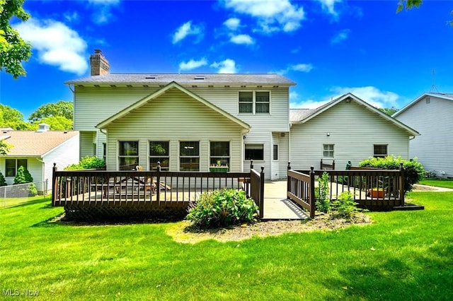 452 Herbert Rd, Akron, OH 44312 - rear view of property with a wooden deck, a chimney, and a yard