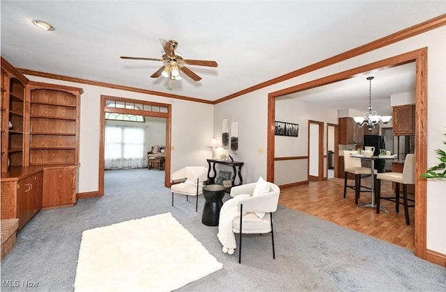 452 Herbert Rd, Akron, OH 44312 - living area featuring ceiling fan, a chandelier, carpet flooring, baseboards, and crown molding