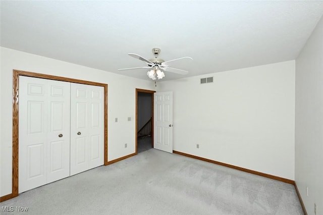 452 Herbert Rd, Akron, OH 44312 - unfurnished bedroom featuring baseboards, light carpet, a closet, and a ceiling fan
