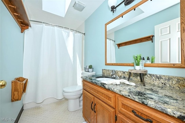 452 Herbert Rd, Akron, OH 44312 - full bath featuring vanity, toilet, a skylight, and tile patterned floors