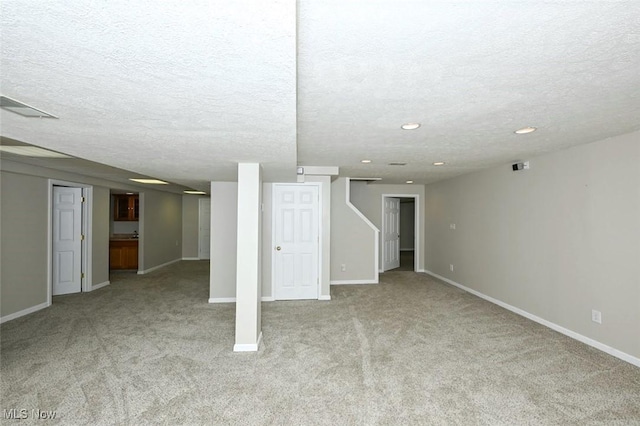452 Herbert Rd, Akron, OH 44312 - finished below grade area featuring light colored carpet, a textured ceiling, baseboards, and recessed lighting