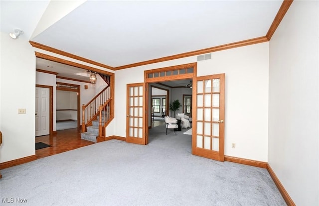 452 Herbert Rd, Akron, OH 44312 - carpeted spare room featuring french doors, ornamental molding, stairs, and baseboards