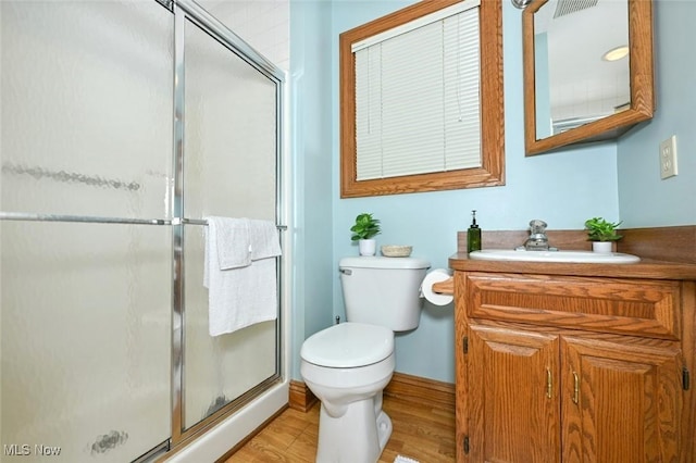 452 Herbert Rd, Akron, OH 44312 - full bathroom with toilet, a shower stall, vanity, and wood finished floors