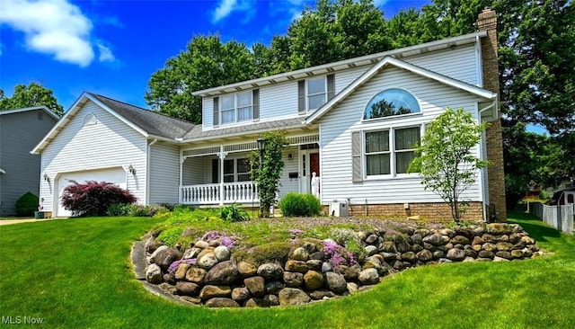 452 Herbert Rd, Akron, OH 44312 - traditional-style home featuring a porch, an attached garage, and a chimney