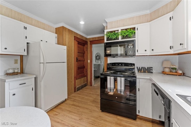 1372 W State St, Salem, OH 44460 - kitchen with black appliances, light countertops, white cabinets, decorative backsplash, and recessed lighting