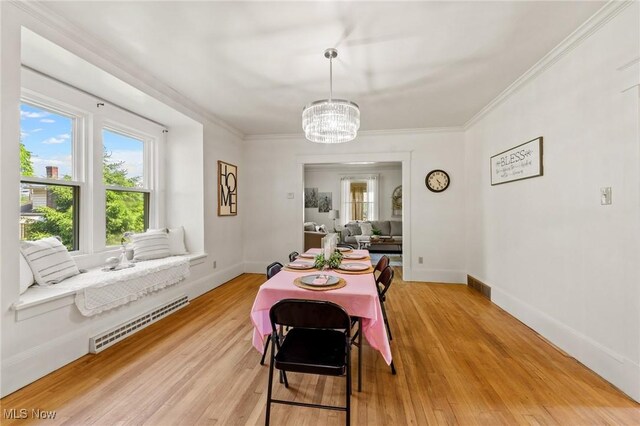 1372 W State St, Salem, OH 44460 - dining room featuring a chandelier, light wood-type flooring, baseboards, and crown molding