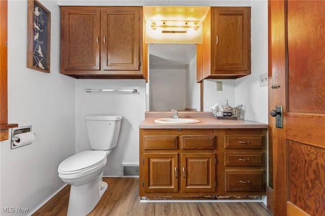 1372 W State St, Salem, OH 44460 - bathroom featuring toilet, vanity, and wood finished floors