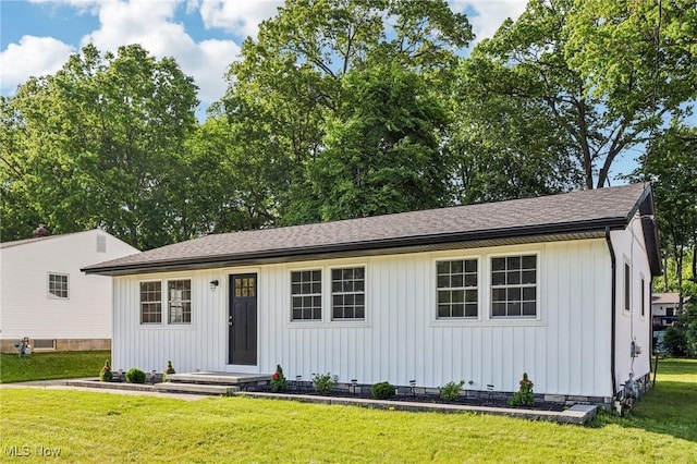 178 Lindsey Rd, Munroe Falls, OH 44262 - view of front of house featuring board and batten siding, a front yard, and roof with shingles