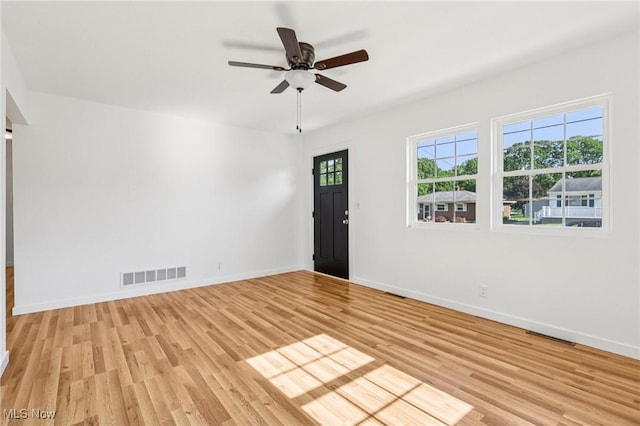 178 Lindsey Rd, Munroe Falls, OH 44262 - unfurnished room featuring light wood-type flooring, ceiling fan, and baseboards