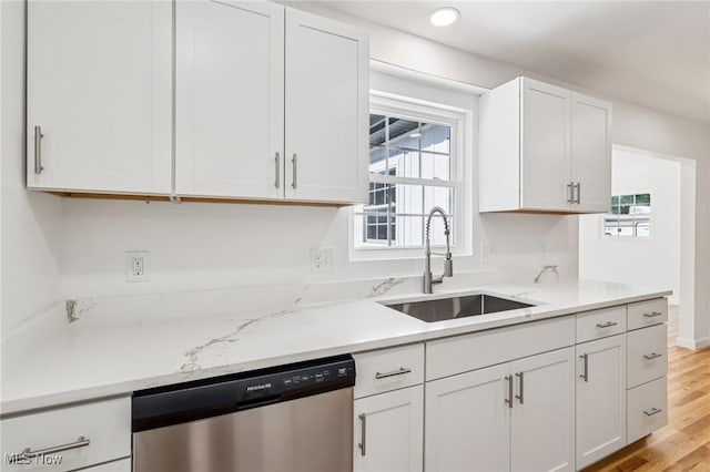 178 Lindsey Rd, Munroe Falls, OH 44262 - kitchen featuring dishwasher, a sink, white cabinetry, and plenty of natural light