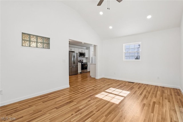 178 Lindsey Rd, Munroe Falls, OH 44262 - unfurnished living room with ceiling fan, light wood-type flooring, recessed lighting, high vaulted ceiling, and baseboards