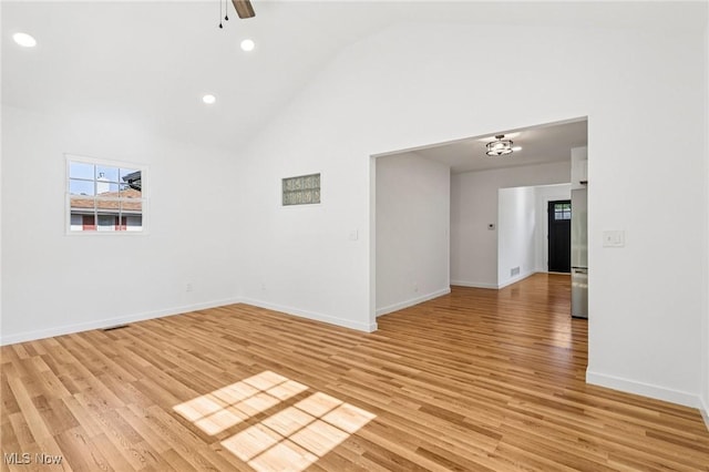 178 Lindsey Rd, Munroe Falls, OH 44262 - empty room featuring high vaulted ceiling, light wood-style flooring, baseboards, recessed lighting, and ceiling fan