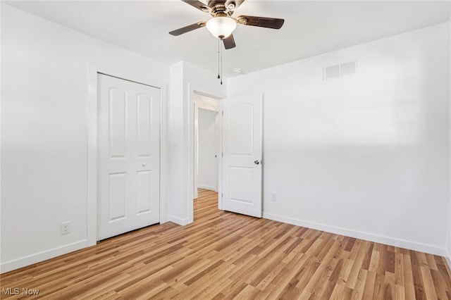 178 Lindsey Rd, Munroe Falls, OH 44262 - unfurnished bedroom featuring baseboards, light wood finished floors, a closet, and ceiling fan