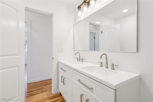 178 Lindsey Rd, Munroe Falls, OH 44262 - bathroom featuring double vanity, wood finished floors, and baseboards