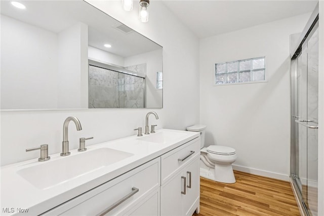 178 Lindsey Rd, Munroe Falls, OH 44262 - full bath with a shower stall, toilet, double vanity, wood finished floors, and recessed lighting