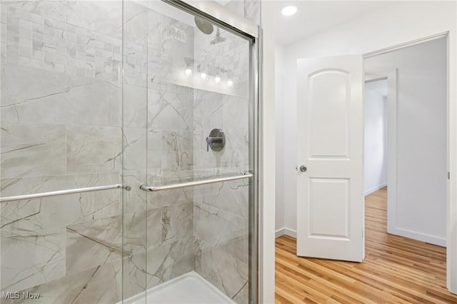 178 Lindsey Rd, Munroe Falls, OH 44262 - bathroom featuring a stall shower, wood finished floors, and baseboards