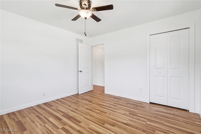 178 Lindsey Rd, Munroe Falls, OH 44262 - unfurnished bedroom featuring light wood-style flooring, baseboards, a closet, and ceiling fan