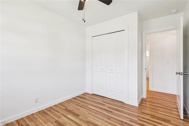 178 Lindsey Rd, Munroe Falls, OH 44262 - unfurnished bedroom with light wood finished floors, baseboards, a closet, and ceiling fan