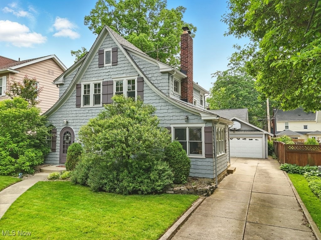 2133 19th St, Cuyahoga Falls, OH 44223 - view of front of house with a chimney and a garage