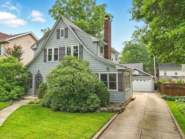 2133 19th St, Cuyahoga Falls, OH 44223 - view of front of house with a chimney and a garage